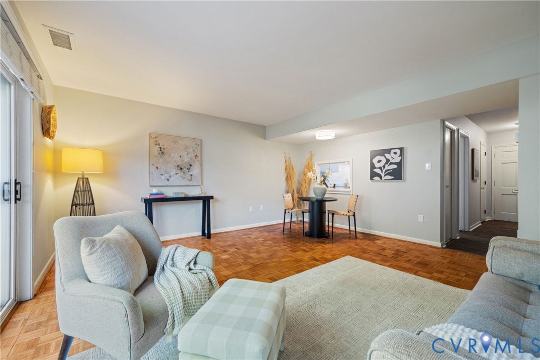 9131 Derbyshire Road, #B, Deerwood Condominiums, Henrico, VA 23229 Parquet wood-finish flooring, sliding glass door, and interior pass-through window