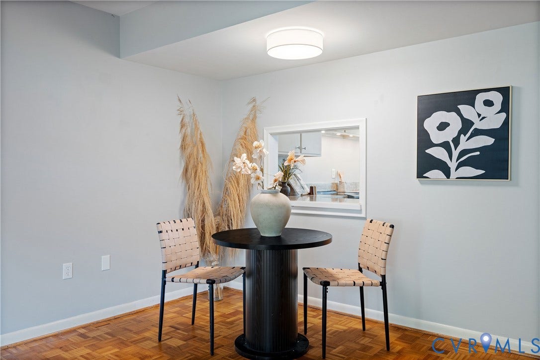 9131 Derbyshire Road, #B, Deerwood Condominiums, Henrico, VA 23229 Parquet wood-finish flooring, ceiling-mounted drum light fixture, and interior pass-through opening