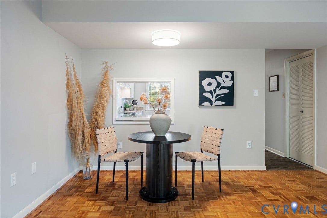 9131 Derbyshire Road, #B, Deerwood Condominiums, Henrico, VA 23229 Parquet wood-finish flooring, recessed wall opening with white casing, and flush-mount ceiling lighting