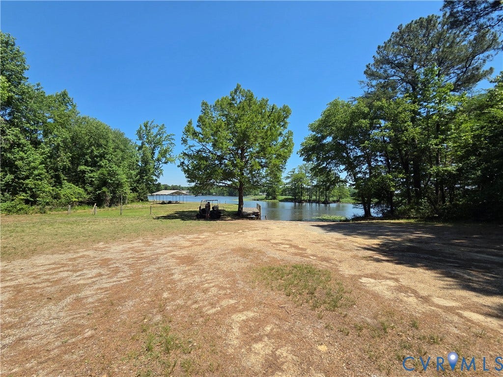 7620 Cypress Drive, Lanexa, VA 23089 Waterfront lot featuring a natural shoreline, mature trees, open grounds, and a private boat slip
