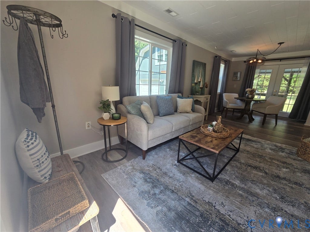 7620 Cypress Drive, Lanexa, VA 23089 Wood-finish flooring, grid-pattern windows, multi-pane glass door, and a textured ceiling finish
