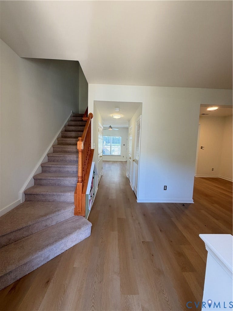 3105 Friars Walk Lane, Glen Allen, VA 23059 Wood-finish flooring, staircase with a wooden handrail, and flush-mount ceiling light fixtures