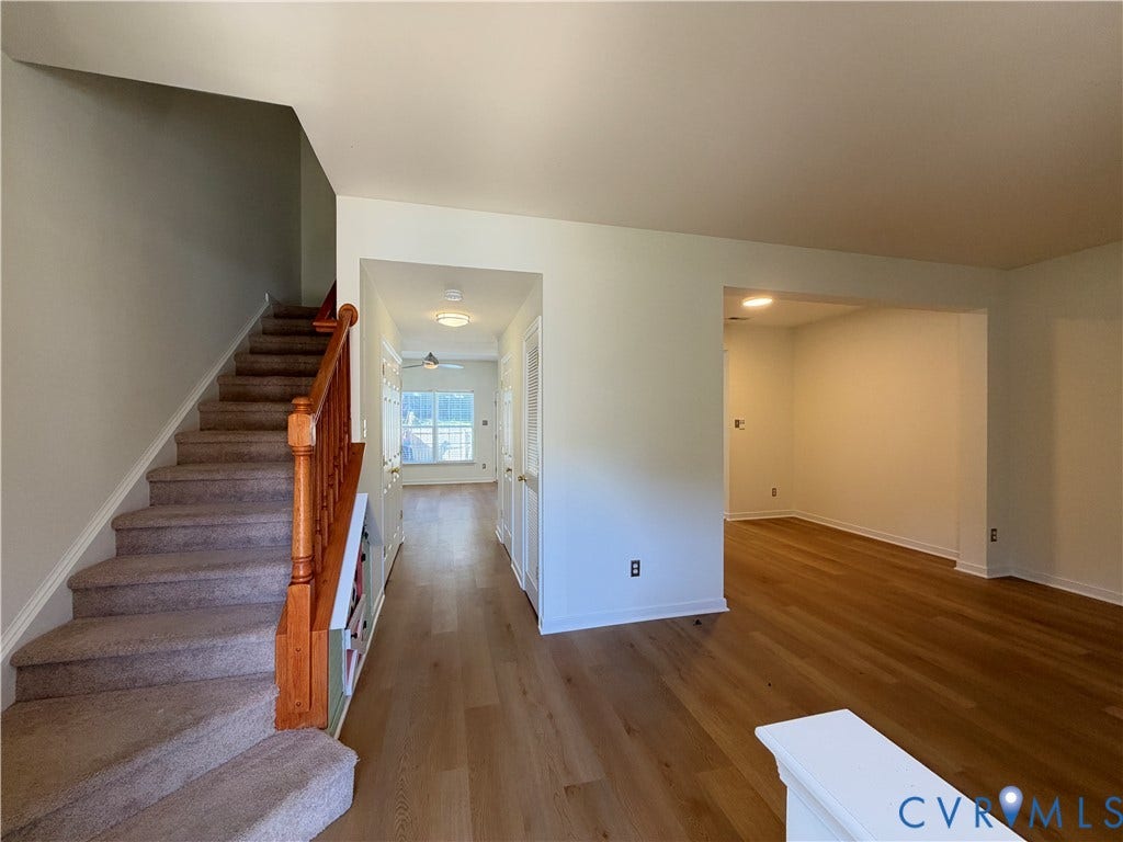 3105 Friars Walk Lane, Glen Allen, VA 23059 Staircase featuring wood railings and carpeted treads, wood-finish flooring, and recessed ceiling lighting