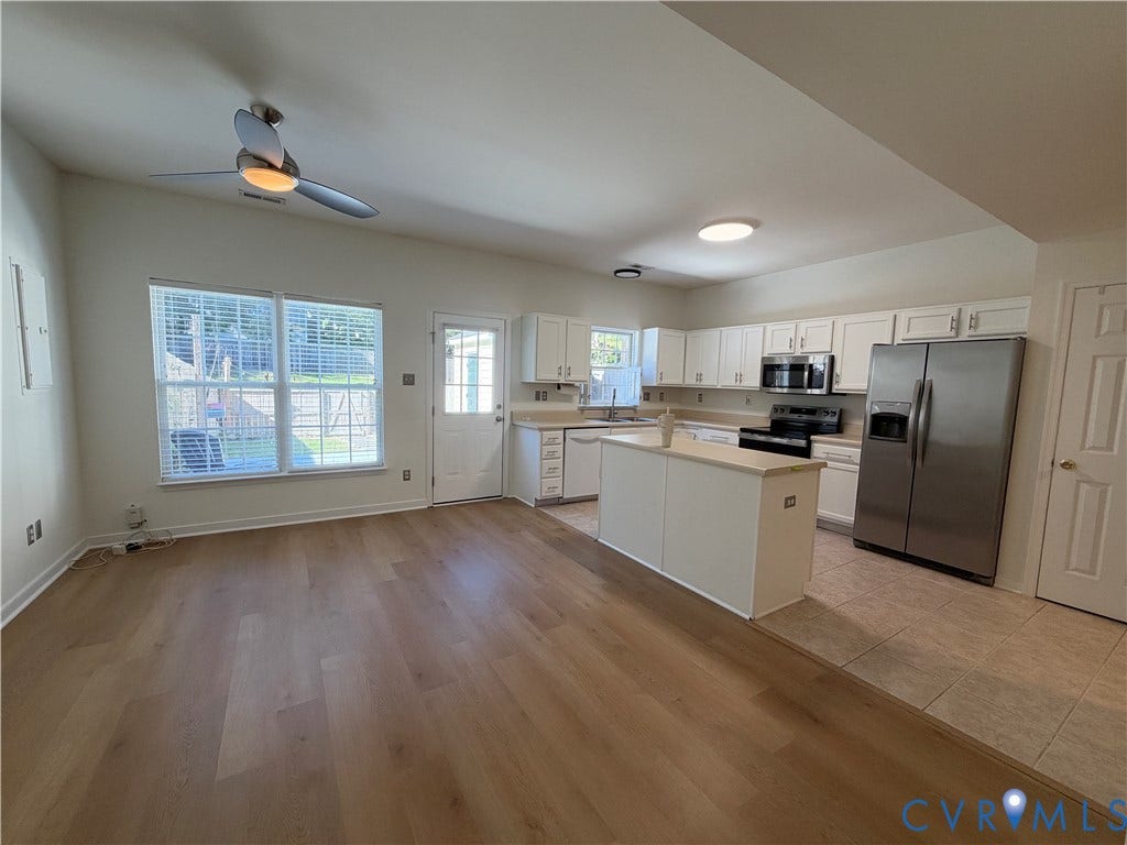 3105 Friars Walk Lane, Glen Allen, VA 23059 Kitchen featuring white cabinetry, an island with countertop, stainless steel appliances, wood-finish flooring, and a ceiling fan