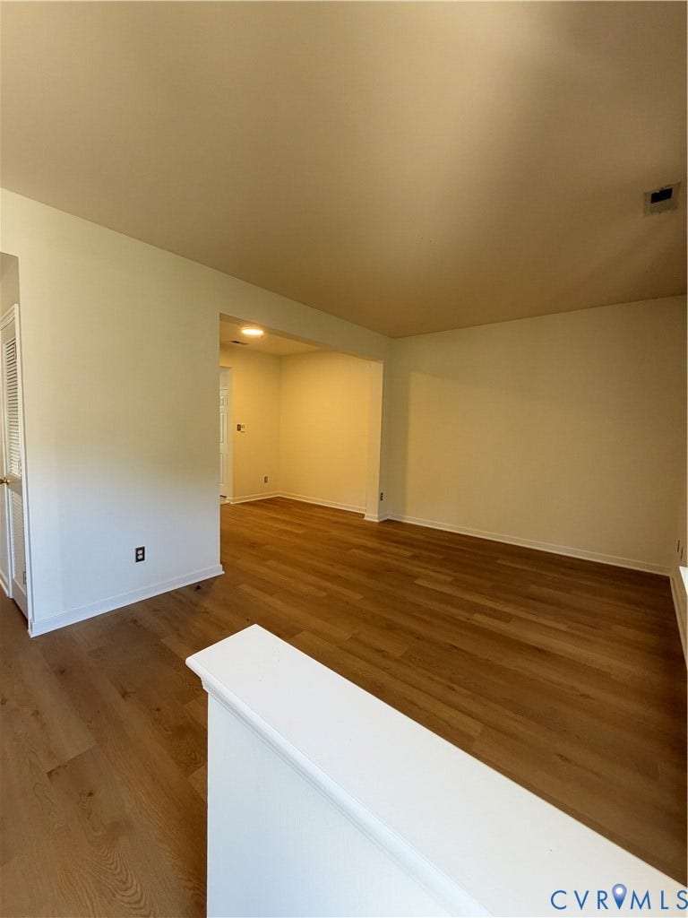 3105 Friars Walk Lane, Glen Allen, VA 23059 Interior area featuring wood-finish flooring, white walls, and a partial wall divider