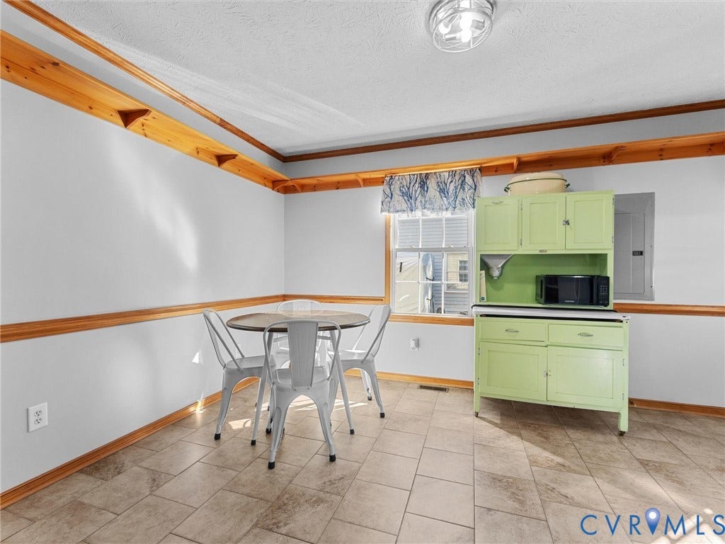 209 Taraby Drive, Hunters Run, Sandston, VA 23150 Tile flooring, natural wood chair rail, upper wood wall shelving, and a built-in cabinet