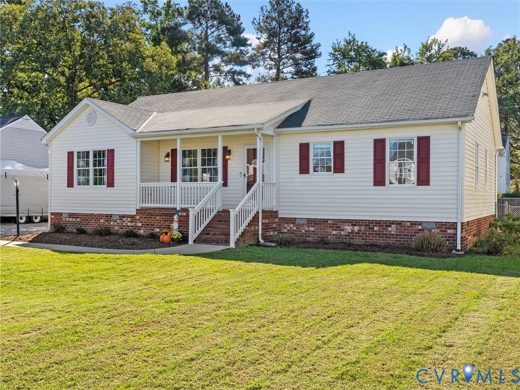 209 Taraby Drive, Hunters Run, Sandston, VA 23150 Single-story residence featuring horizontal siding, a red brick veneer foundation, contrasting window shutters, and a covered front porch with white railing