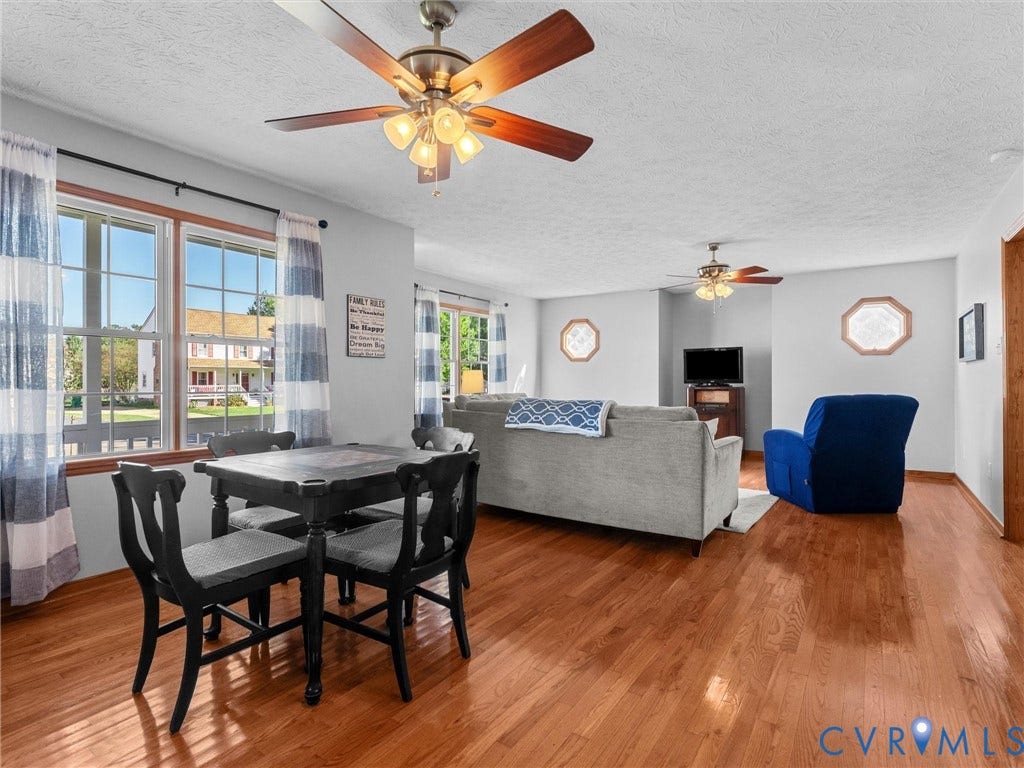209 Taraby Drive, Hunters Run, Sandston, VA 23150 Wood-finish flooring, dual ceiling fans with integrated light fixtures, and octagonal accent windows