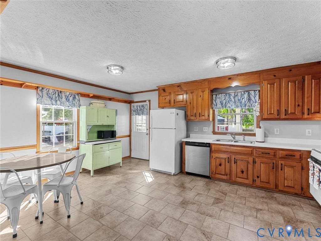 209 Taraby Drive, Hunters Run, Sandston, VA 23150 Kitchen featuring natural wood cabinetry, tile flooring, stainless steel dishwasher, white refrigerator, and a built-in hutch