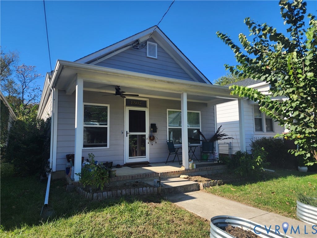 1502 N 19th Street, Church Hill, Richmond, VA 23223 Craftsman-style exterior featuring horizontal siding, a covered front porch with square columns, a mounted ceiling fan, and masonry detailing