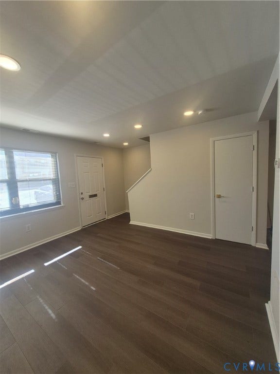 17 Jarratt Court, Petersburg, VA 23803 Interior space featuring wood-finish flooring, recessed ceiling lighting, a solid-panel entry door, and painted wall finishes