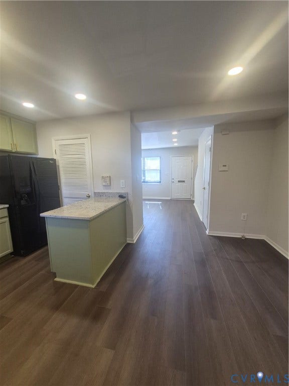 17 Jarratt Court, Petersburg, VA 23803 Kitchen area featuring wood-finish flooring, a stone-surface peninsula, recessed lighting, and a louvered pantry door
