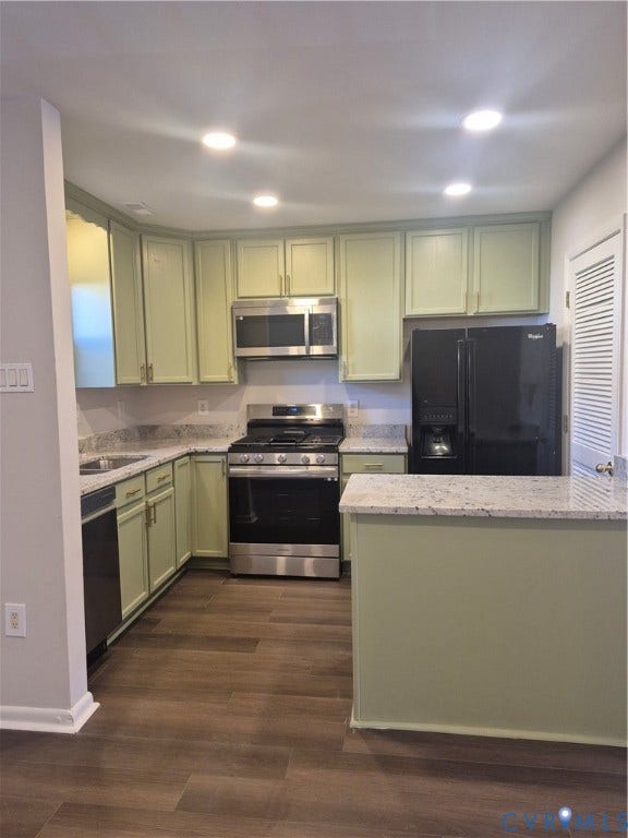 17 Jarratt Court, Petersburg, VA 23803 Kitchen featuring light green cabinetry, speckled stone-finish countertops, stainless steel gas range, built-in microwave, and wood-finish flooring