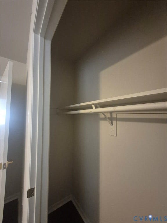 17 Jarratt Court, Petersburg, VA 23803 Reach-in closet featuring a built-in shelving unit, integrated garment rod, and neutral wall finish