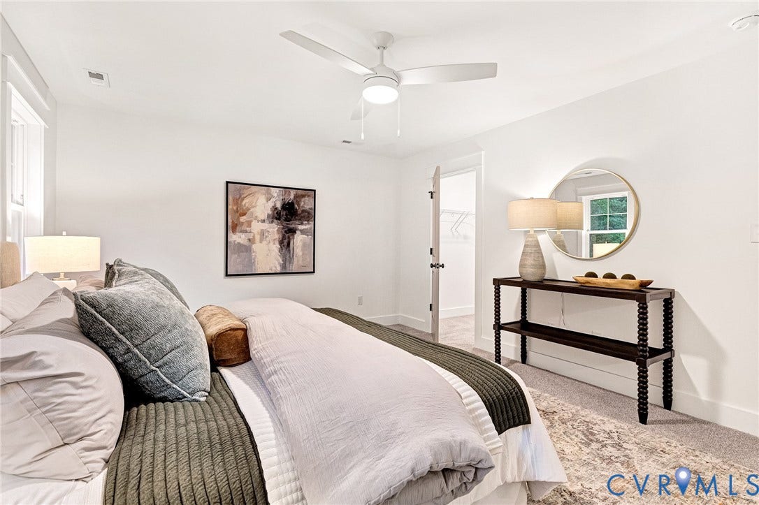 9107 Terroir Lane, Viniterra Villas, New Kent, VA 23124 Neutral interior space featuring white walls, wall-to-wall carpeting, and a modern three-blade ceiling fan with integrated lighting