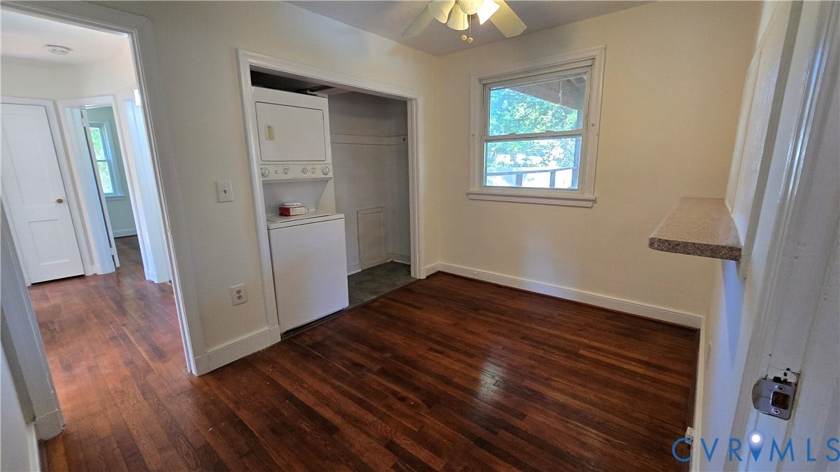38 Eastlake Drive, Sandston, Sandston, VA 23150 Wood-finish flooring, recessed laundry area with stacked laundry appliances, ceiling fan, and built-in wall ledge
