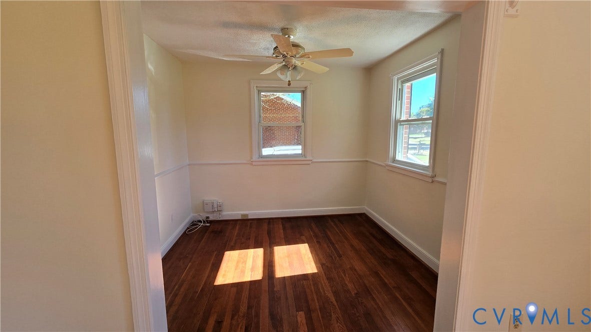 38 Eastlake Drive, Sandston, Sandston, VA 23150 Wood-finish flooring, chair rail molding, dual-pane windows, and a ceiling fan with integrated lighting