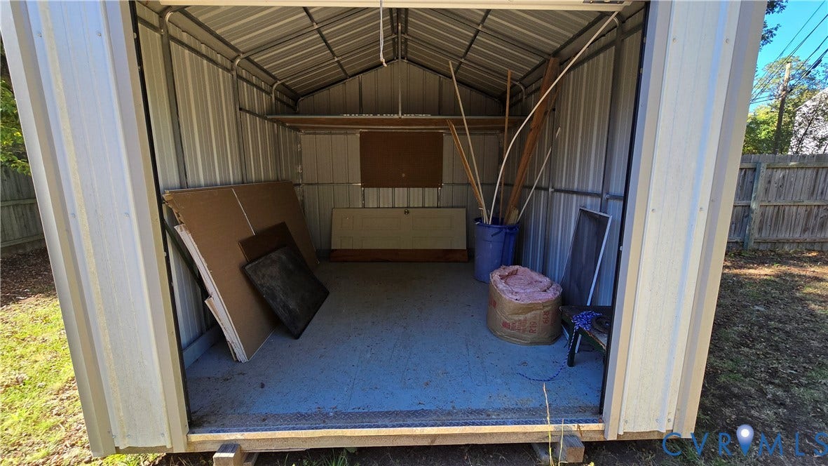 38 Eastlake Drive, Sandston, Sandston, VA 23150 Detached storage structure featuring metal wall panels, a peaked roofline, reinforced metal framing, and a level floor surface