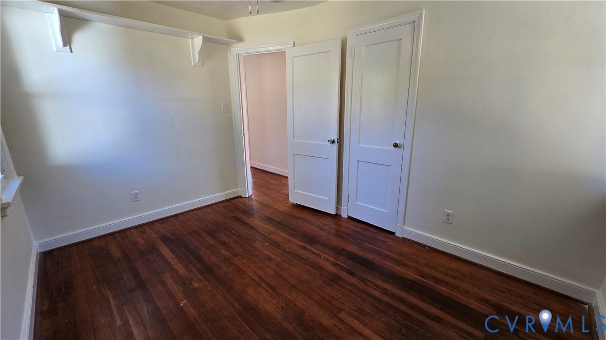 38 Eastlake Drive, Sandston, Sandston, VA 23150 Room featuring wood-finish flooring, two-panel interior doors, and built-in wall shelving