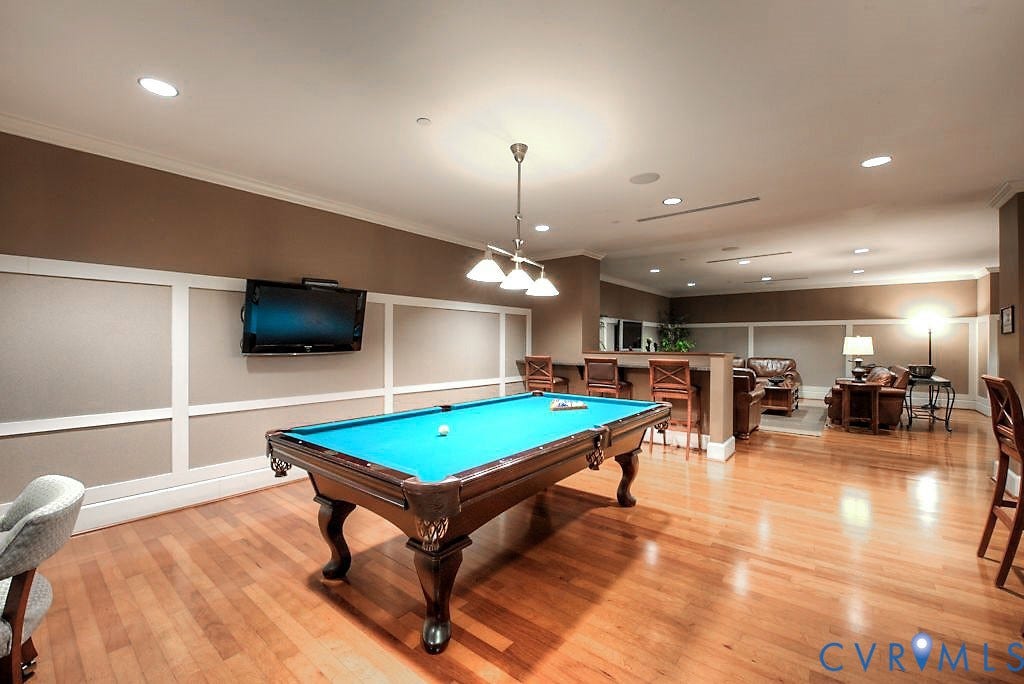 301 Virginia Street, #U1712, Richmond, VA 23219 Wood-finish flooring, wainscoting paneling, recessed lighting, and a built-in bar counter