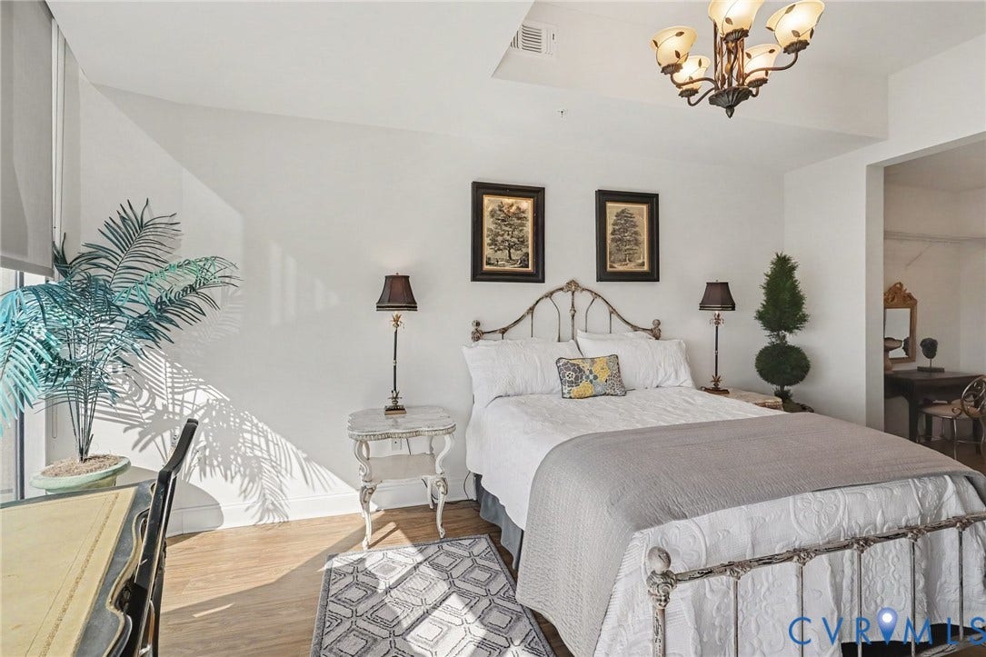 301 Virginia Street, #U1712, Richmond, VA 23219 Wood-finish flooring, high ceilings, and a decorative multi-arm chandelier