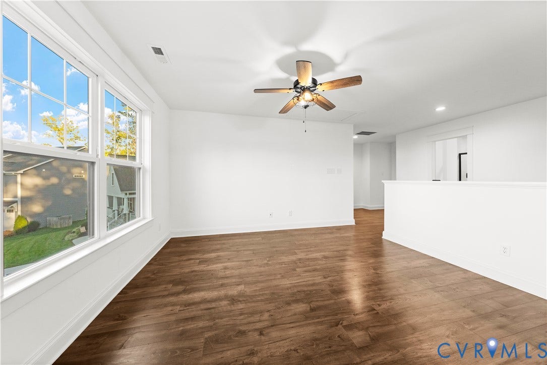 2613 Lilybank Place, NewMarket At RounTrey, Midlothian, VA 23112 Wood-finish flooring, multi-pane windows, and a ceiling fan with integrated lighting