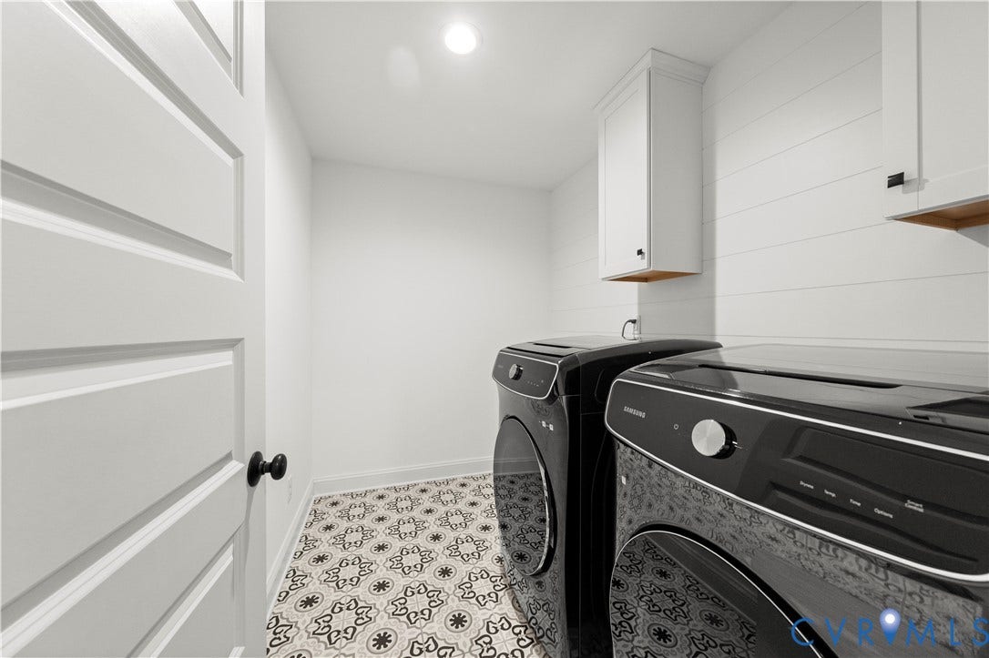 2613 Lilybank Place, NewMarket At RounTrey, Midlothian, VA 23112 Laundry space featuring patterned tile flooring, white horizontal shiplap wall detailing, and shaker-style upper cabinetry
