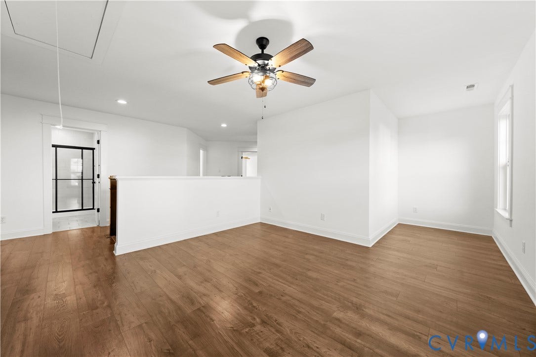 2613 Lilybank Place, NewMarket At RounTrey, Midlothian, VA 23112 Open-concept interior featuring wood-finish flooring, a ceiling fan with integrated lighting, recessed lighting, and a half-wall partition