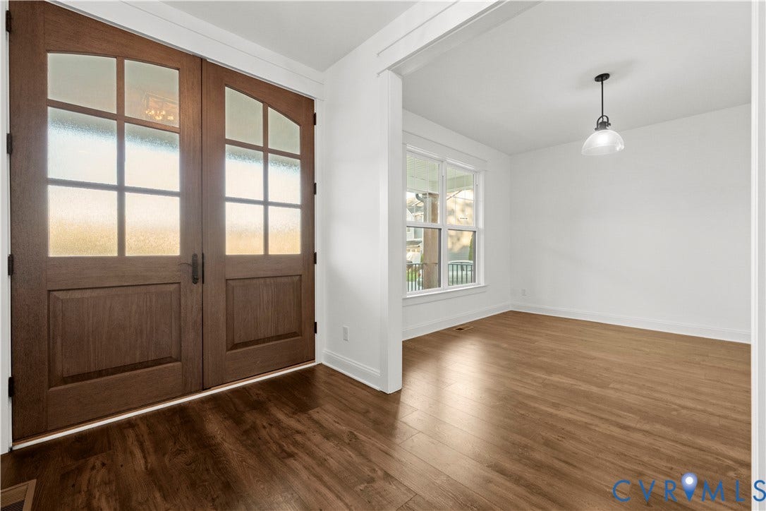 2613 Lilybank Place, NewMarket At RounTrey, Midlothian, VA 23112 Double wooden entry doors with glass panels, wood-finish flooring, and a pendant light fixture