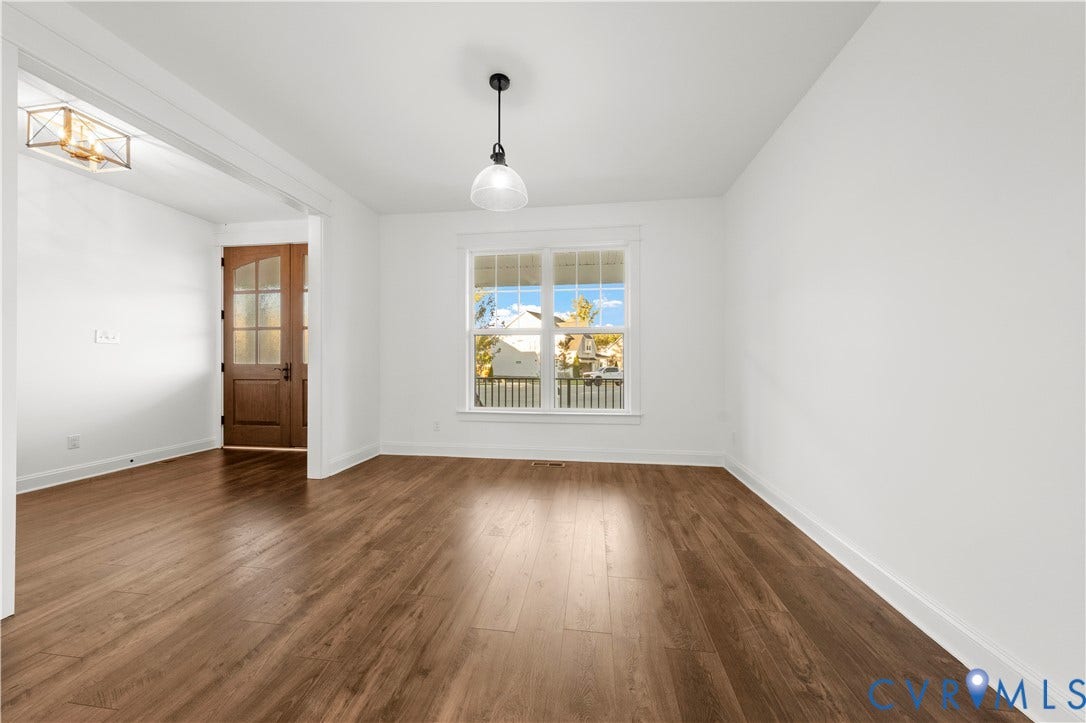 2613 Lilybank Place, NewMarket At RounTrey, Midlothian, VA 23112 Wood-finish flooring, central pendant lighting, recessed entry door with glass paneling, and multi-pane window
