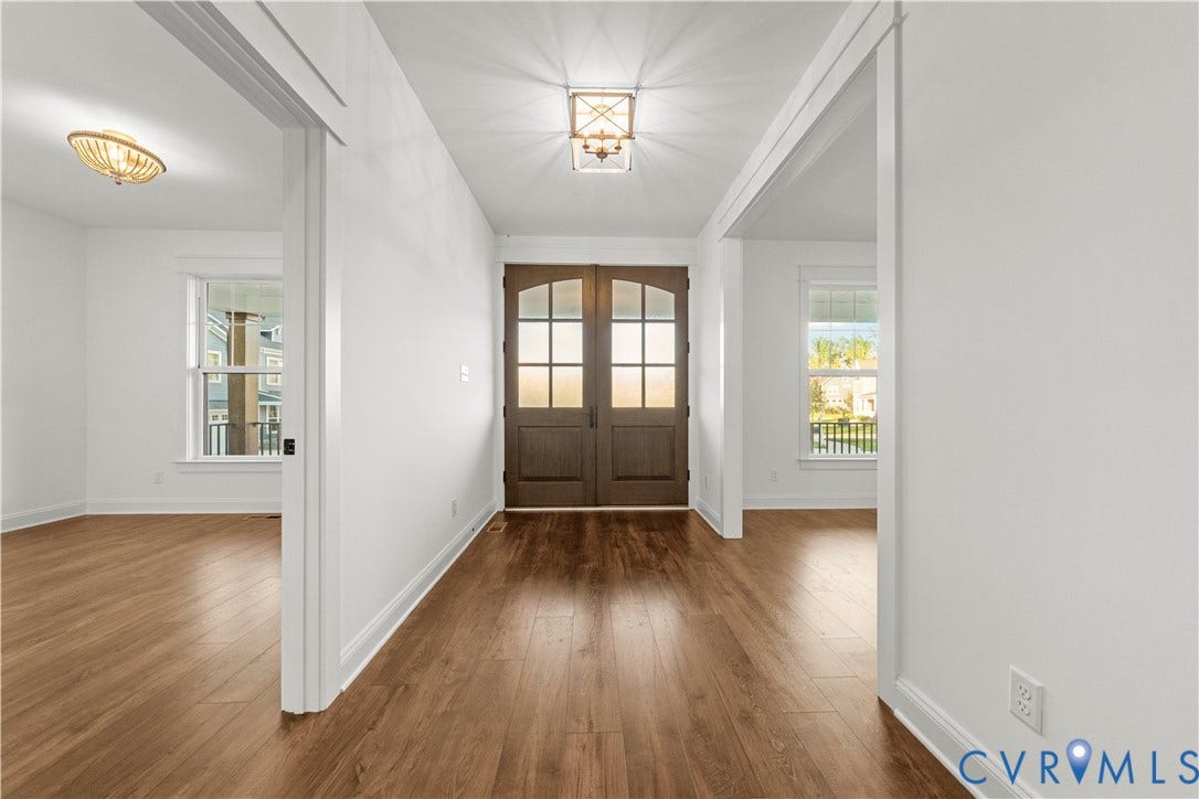 2613 Lilybank Place, NewMarket At RounTrey, Midlothian, VA 23112 Double entry doors featuring glass paneling, wood-finish flooring, and multi-light geometric ceiling fixtures
