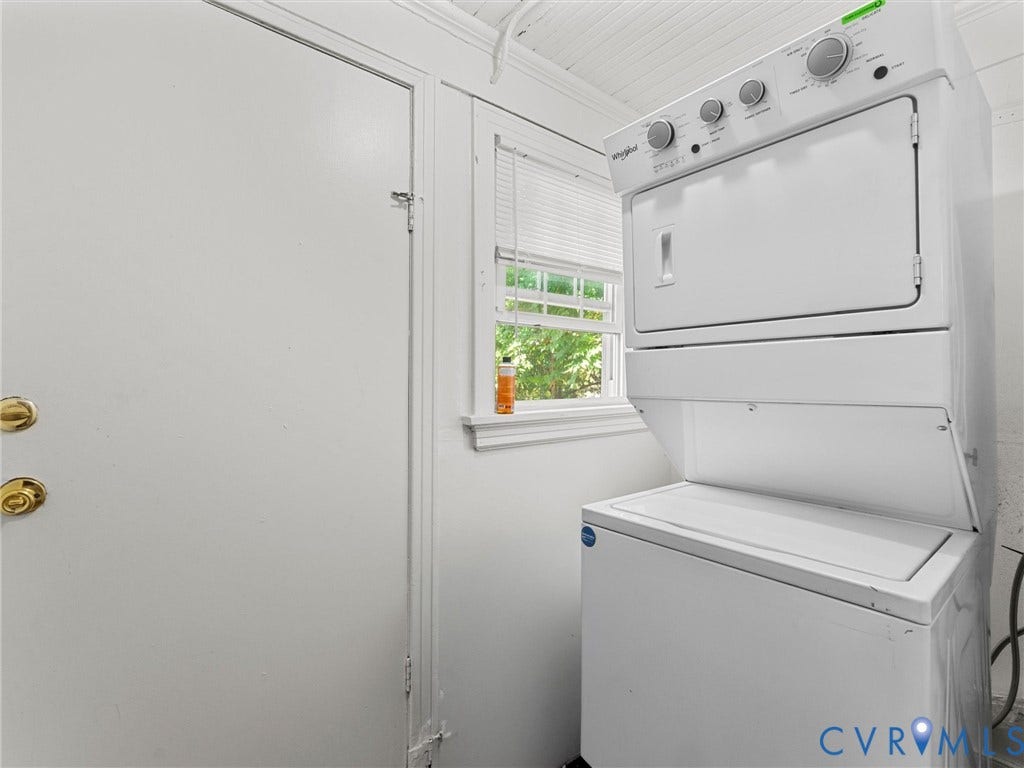 2305 Halifax Avenue, Oak Grove, Sandston, VA 23224 Stacked laundry unit, window with horizontal blinds, beadboard ceiling, and solid-core door with metallic hardware