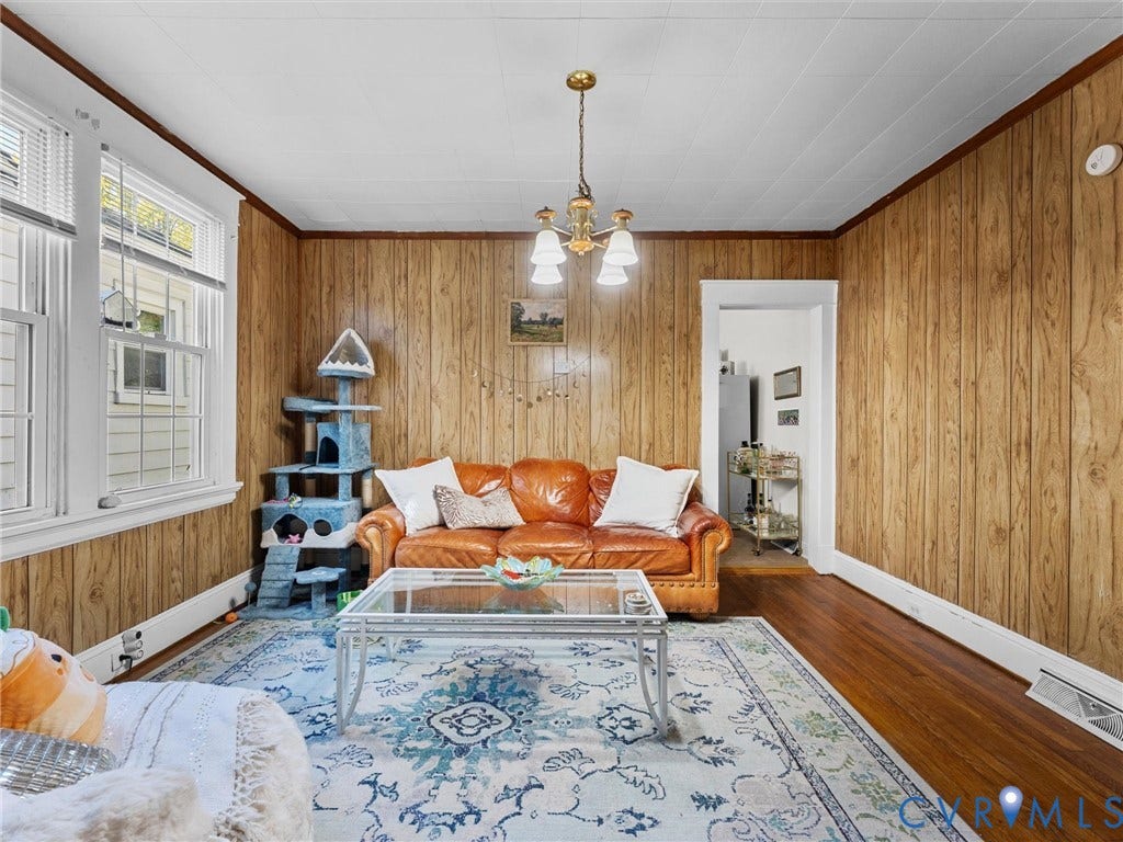2305 Halifax Avenue, Oak Grove, Sandston, VA 23224 Interior room featuring wood-paneled walls, hardwood flooring, multi-pane windows, and a classic four-light ceiling chandelier