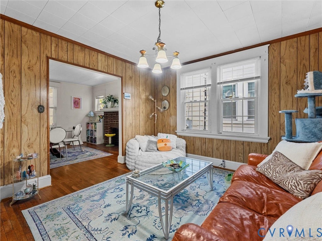 2305 Halifax Avenue, Oak Grove, Sandston, VA 23224 Wood-paneled walls, hardwood flooring, multi-pane windows, and a multi-arm pendant light fixture