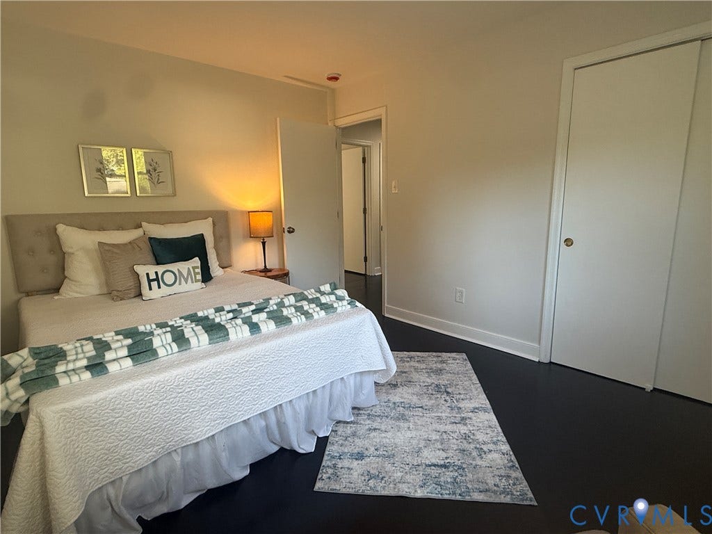 533 Williamsdale Drive, Midlothian, VA 23235 Room featuring dark wood-finish flooring, neutral wall paint, and a built-in sliding-door closet