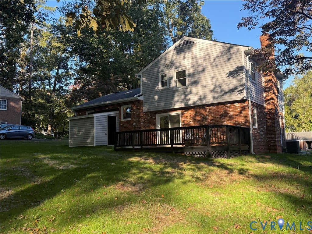 533 Williamsdale Drive, Midlothian, VA 23235 Two-story residence featuring a brick and horizontal siding exterior, attached wood deck, and external brick chimney