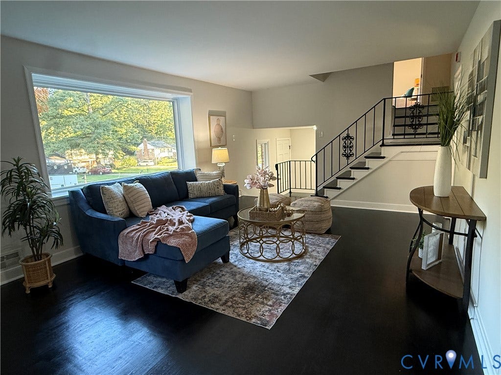 533 Williamsdale Drive, Midlothian, VA 23235 Large picture window, dark hardwood flooring, and open staircase featuring decorative wrought iron railings