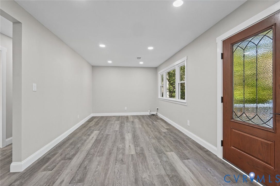 15227 Horseshoe Bridge Road, Hanover, VA 23047 Interior space featuring wood-finish flooring, recessed lighting, neutral wall paint, and a wood entry door with glass paneling