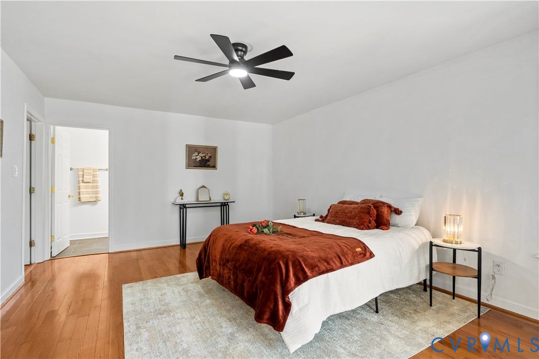 7040 Old Roxbury Road, Average, New Kent, VA 23141 Wood-finish flooring, multi-blade ceiling fan with integrated lighting, and white interior doors