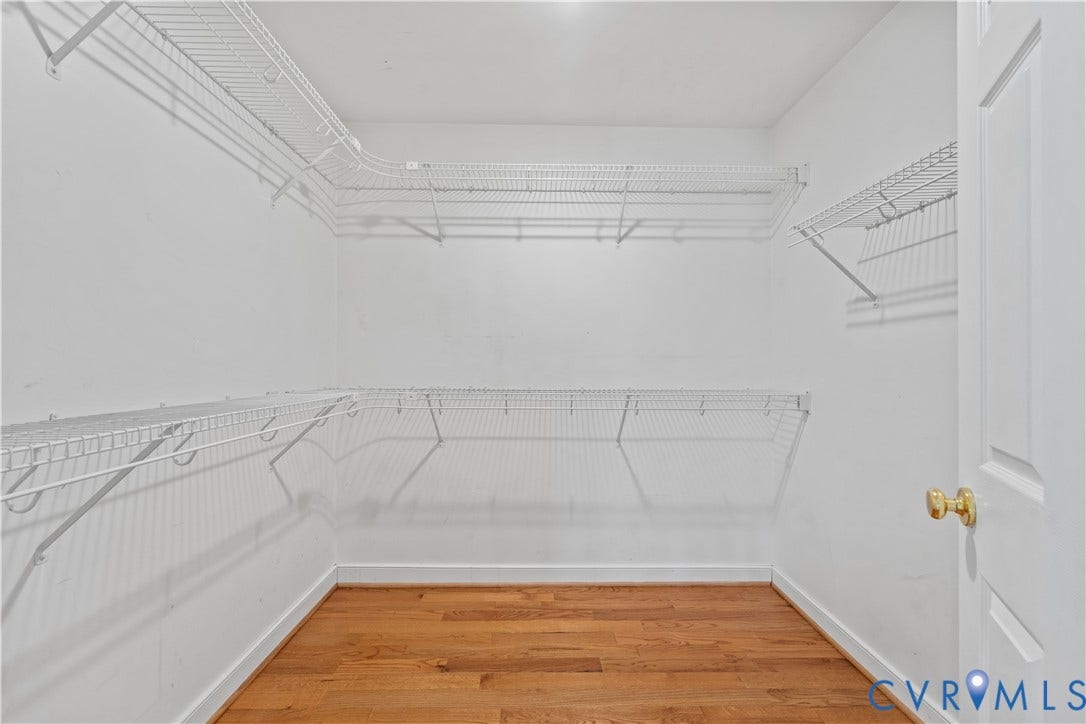7040 Old Roxbury Road, Average, New Kent, VA 23141 Storage area featuring multi-level white wire shelving and wood-finish flooring