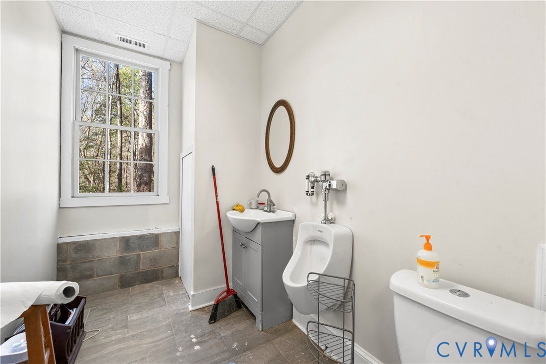 7040 Old Roxbury Road, Average, New Kent, VA 23141 Single-hung window, grey vanity with a vessel sink, wall-mounted urinal, and tile flooring