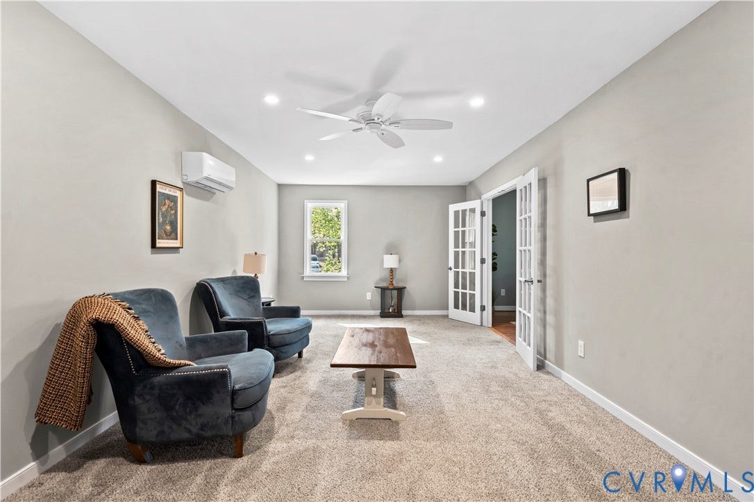 7040 Old Roxbury Road, Average, New Kent, VA 23141 Interior space featuring wall-to-wall carpeting, recessed ceiling lighting, a ceiling fan, a wall-mounted ductless air conditioning unit, and white French doors