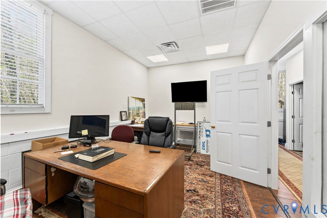 7040 Old Roxbury Road, Average, New Kent, VA 23141 Room featuring a suspended acoustic tile ceiling, recessed panel door, and window with blinds