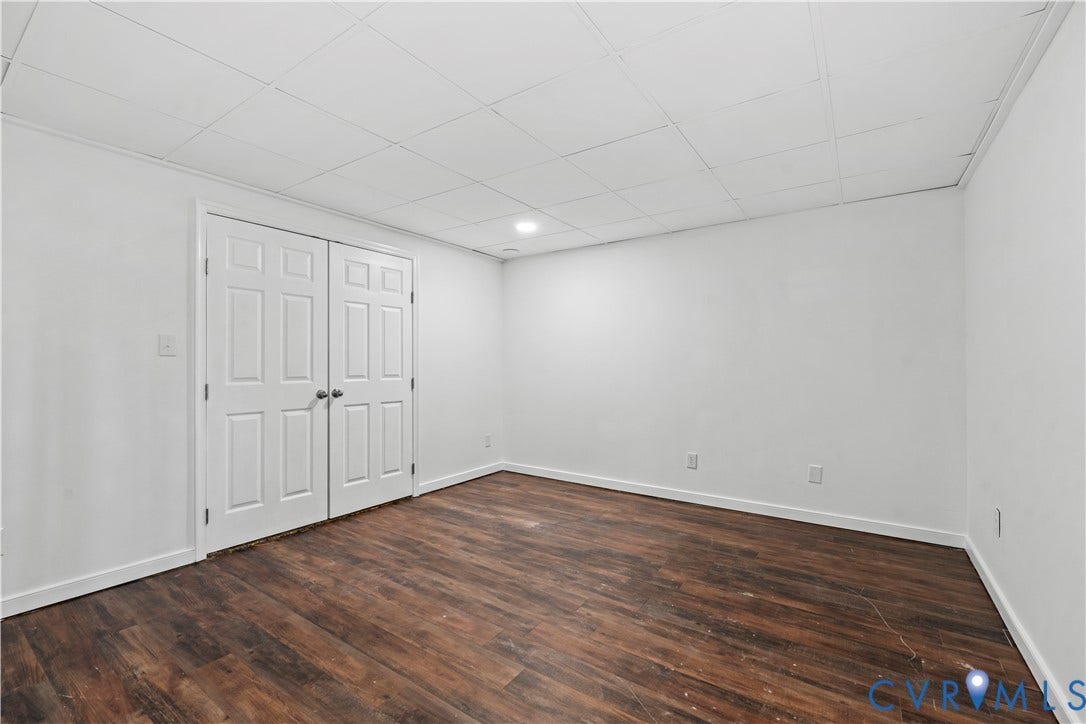 7040 Old Roxbury Road, Average, New Kent, VA 23141 Interior space featuring wood-finish flooring, a suspended drop ceiling, recessed lighting, and double-panel doors