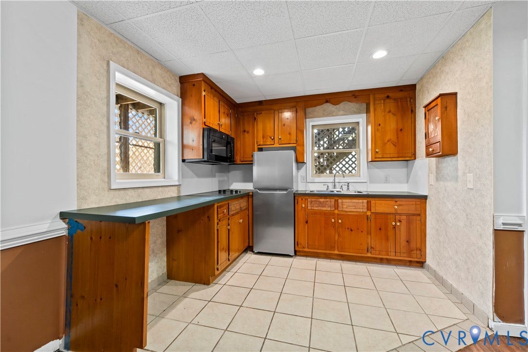 7040 Old Roxbury Road, Average, New Kent, VA 23141 Kitchen featuring natural wood cabinetry, dark countertops, tile flooring, recessed lighting, and stainless steel refrigerator