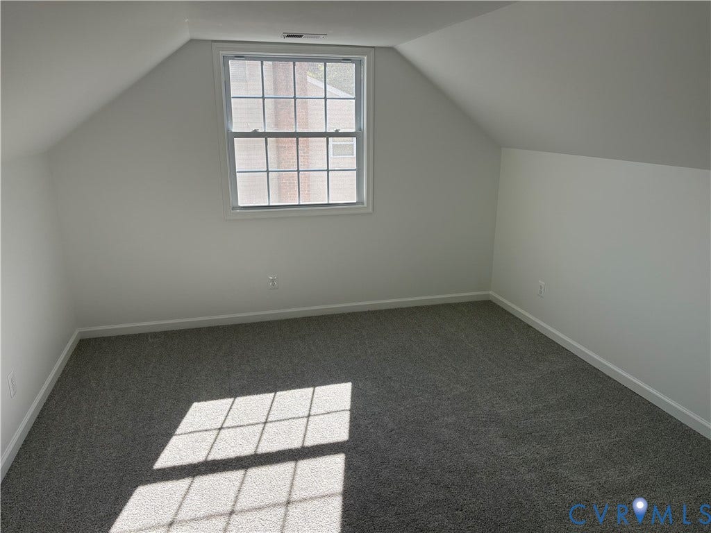 1708 Shewalt Drive, Fairfield, VA 23228 Sloped ceilings, neutral wall color, grey wall-to-wall carpeting, and a multi-pane double-hung window
