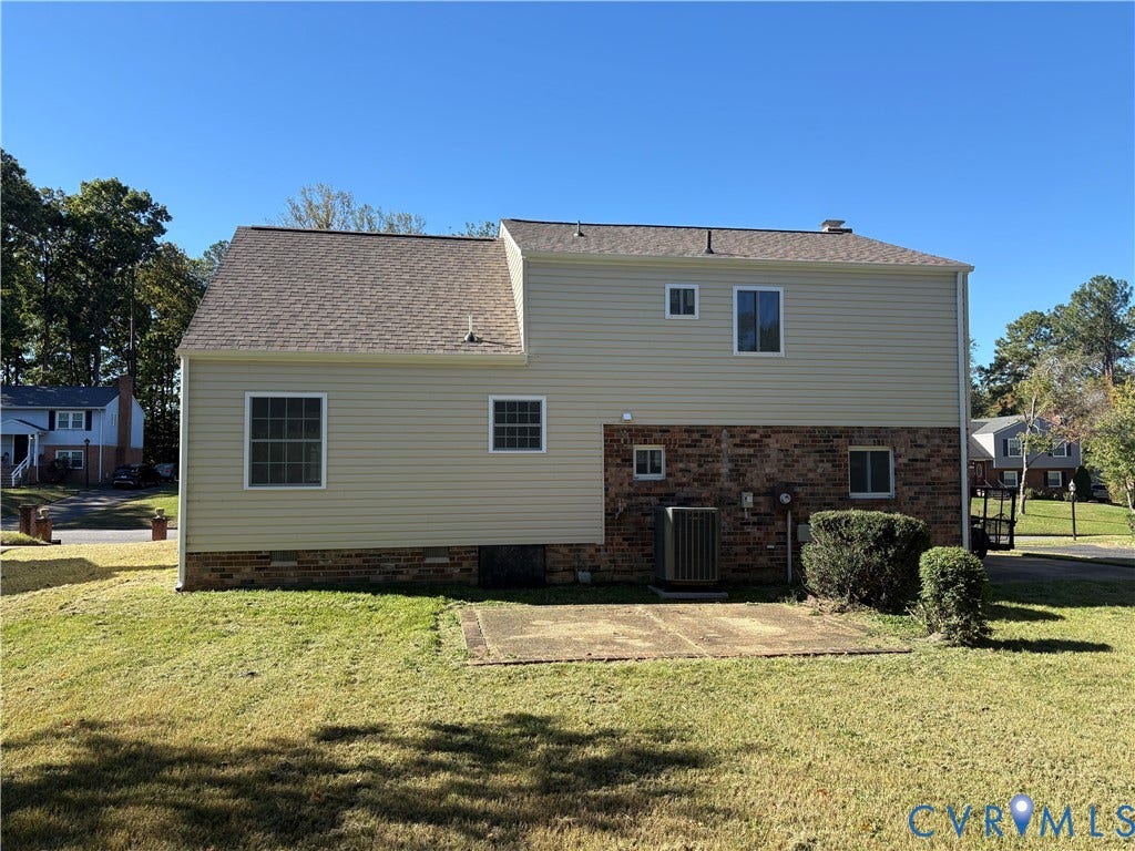 1708 Shewalt Drive, Fairfield, VA 23228 Exterior featuring a combination of light-toned horizontal siding and brick masonry, an asphalt shingle roof, and a concrete patio