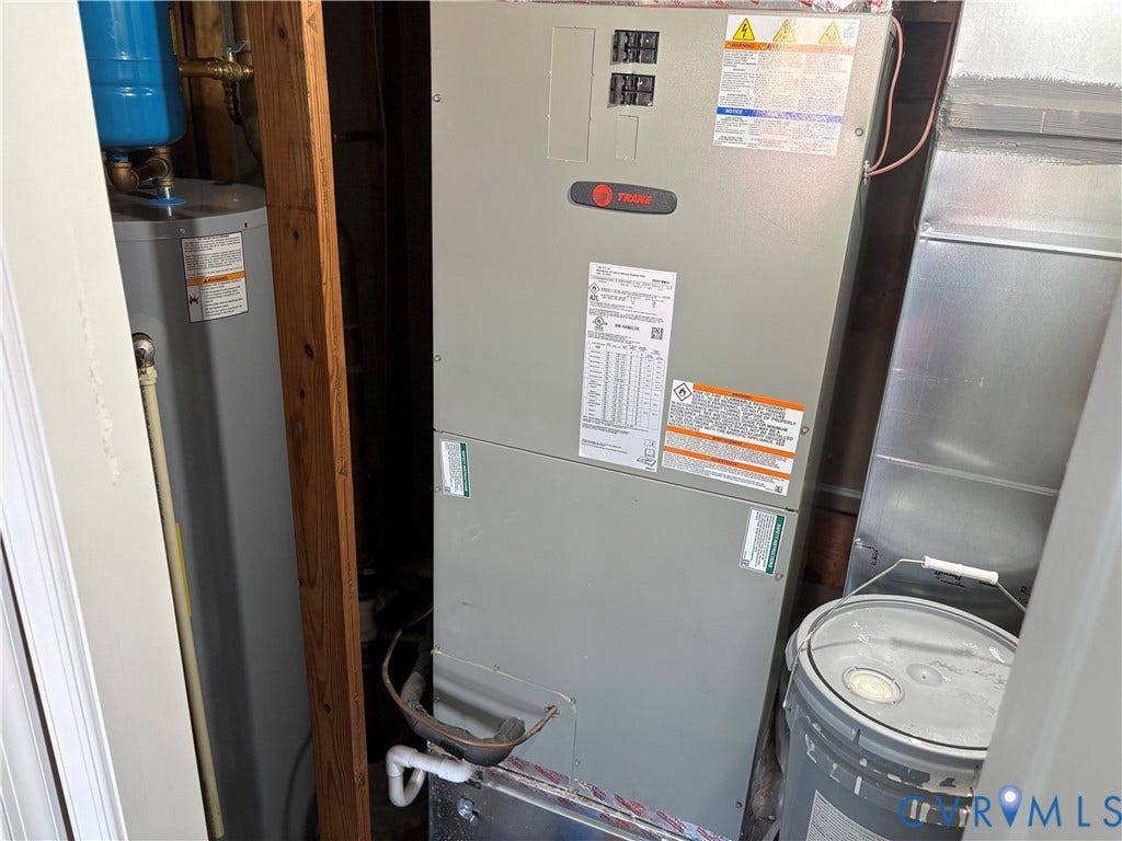 1708 Shewalt Drive, Fairfield, VA 23228 Trane furnace unit paired with a dedicated water heater featuring metal ductwork