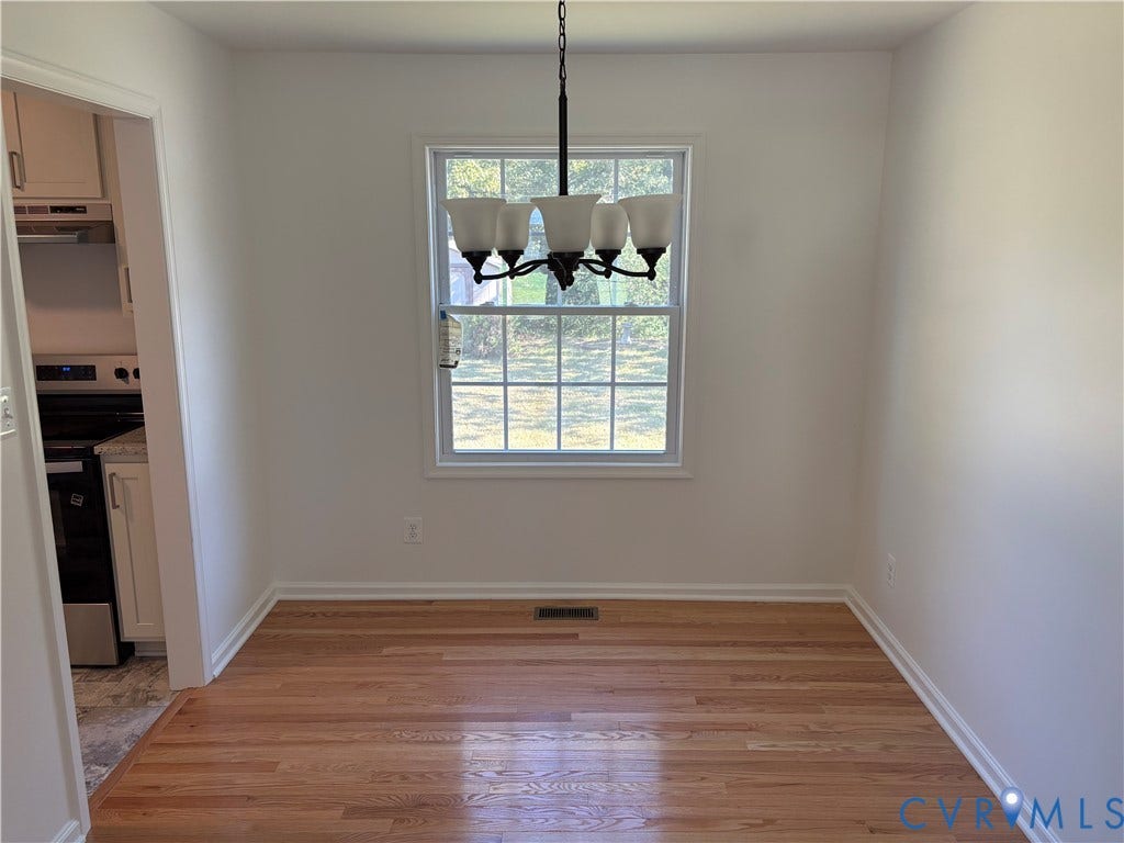 1708 Shewalt Drive, Fairfield, VA 23228 Dining room Wood-finish flooring, and five-light chandelier with frosted glass shades