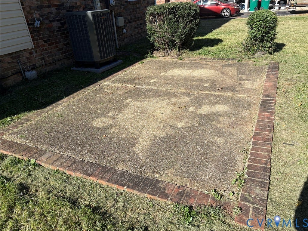 1708 Shewalt Drive, Fairfield, VA 23228 Concrete patio pad framed with decorative brick edging